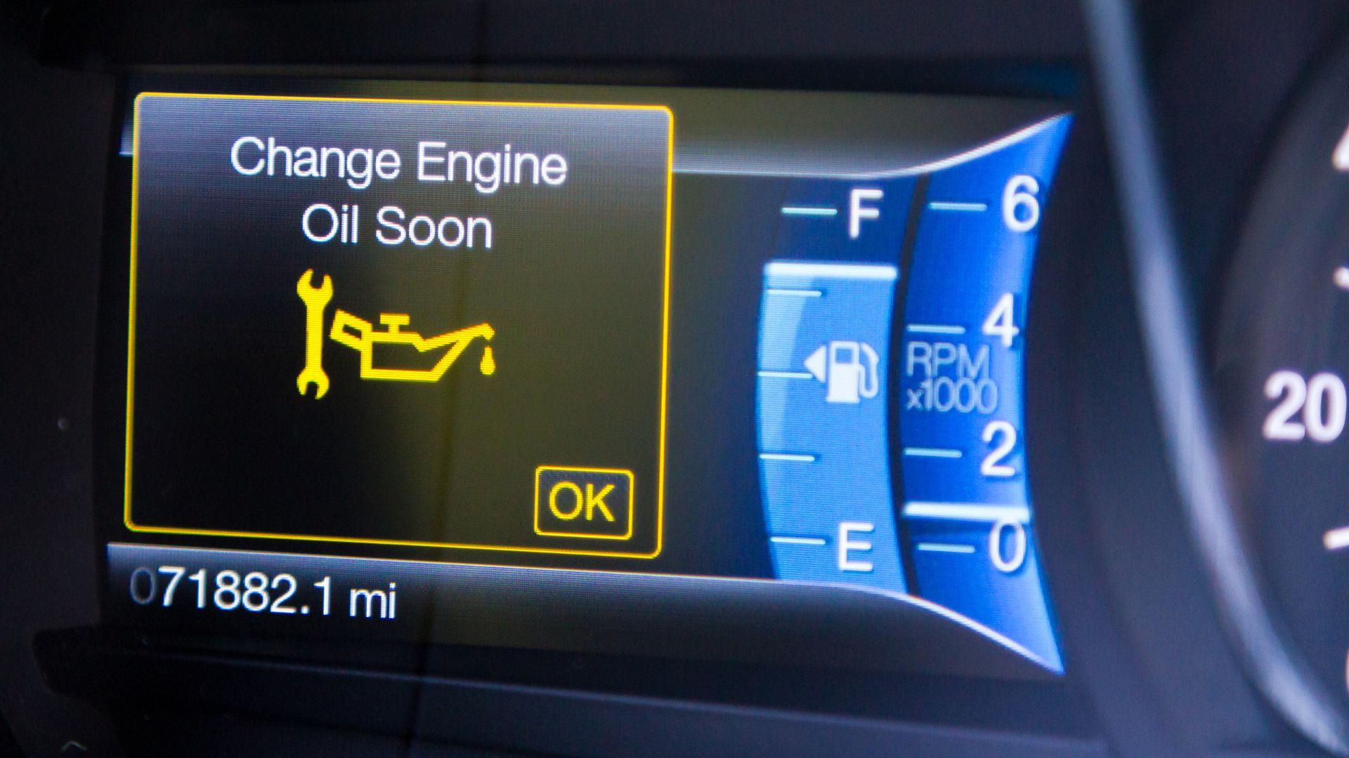 Car dashboard showing change engine oil soon warning at 071882.1 miles