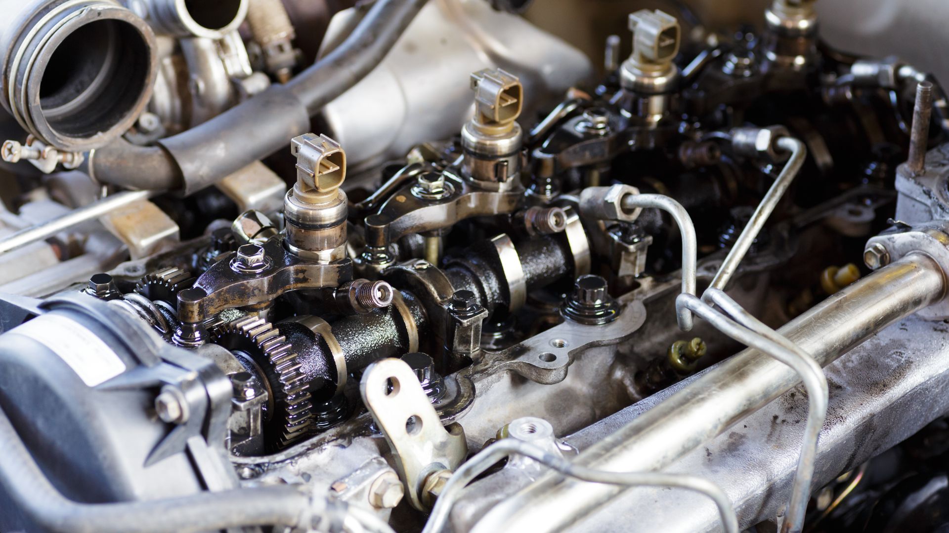 Close-up of a complex engine with gears, pistons, and metal components